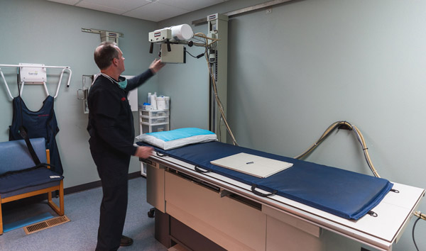 Technician preparing the x-ray machine for an exam